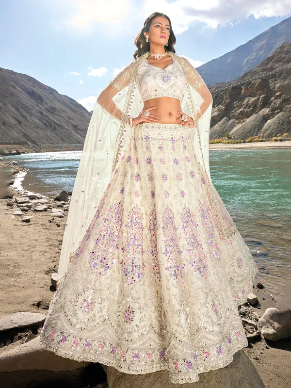 Off white net unstitched lehenga choli