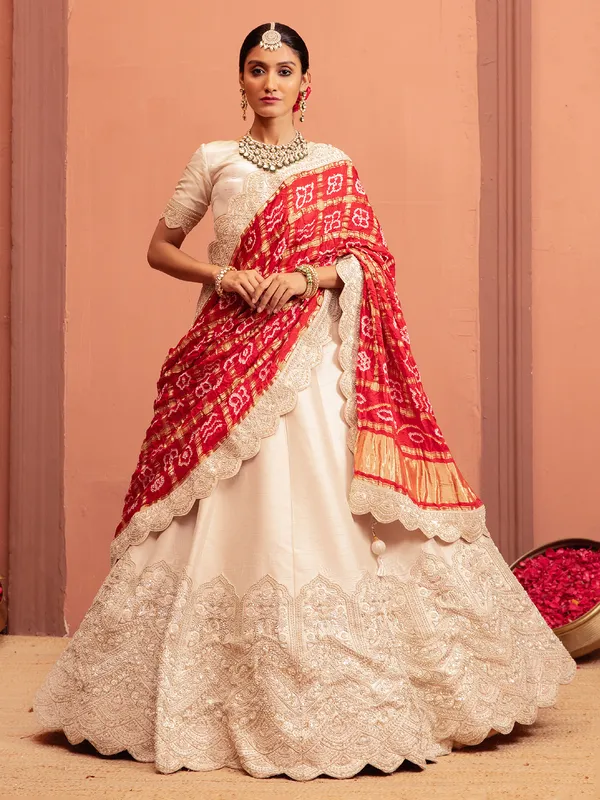 Off white raw silk lehenga choli with embellishments