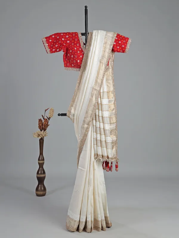 Off white silk saree with resham weaving