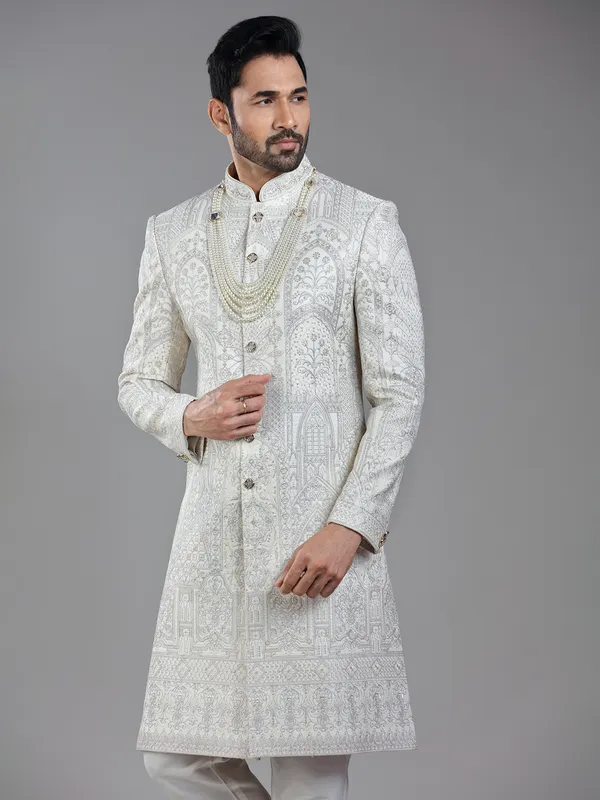 Opulent elegance in cream silk with artistic embroidery and resham