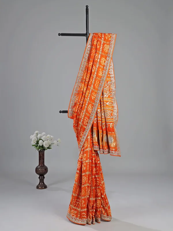 Orange bandhani saree with beaded detailing