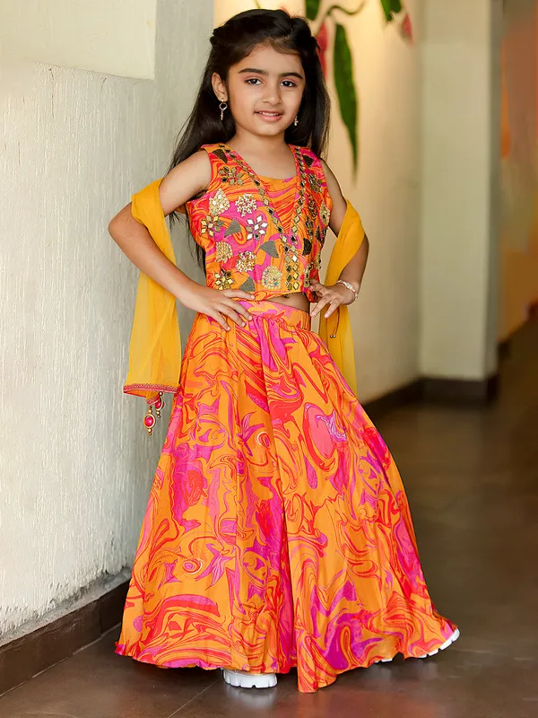 Orange printed crepe lehenga choli with dupatta