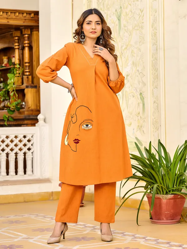Orange silk ensemble with stone highlights