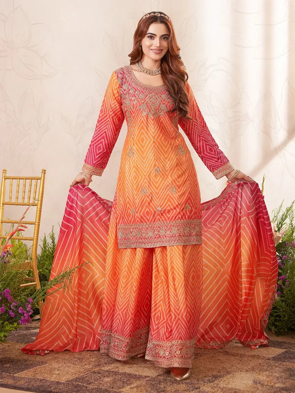 Orange silk palazzo suit with bandhani print
