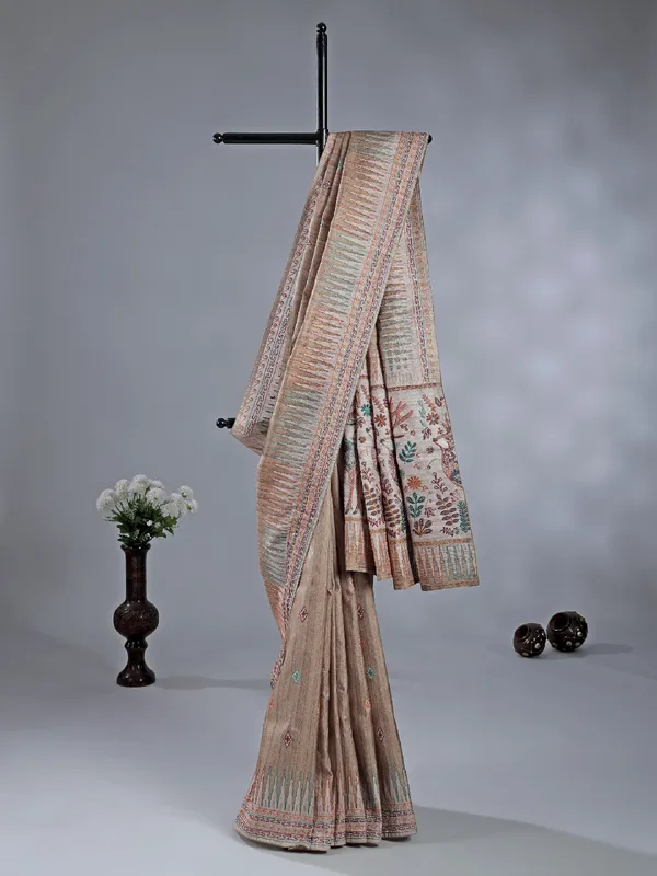 Pastel beige silk saree with intricate thread detailing