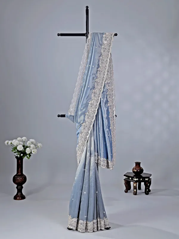 Pastel blue tissue silk saree with classic sequins work