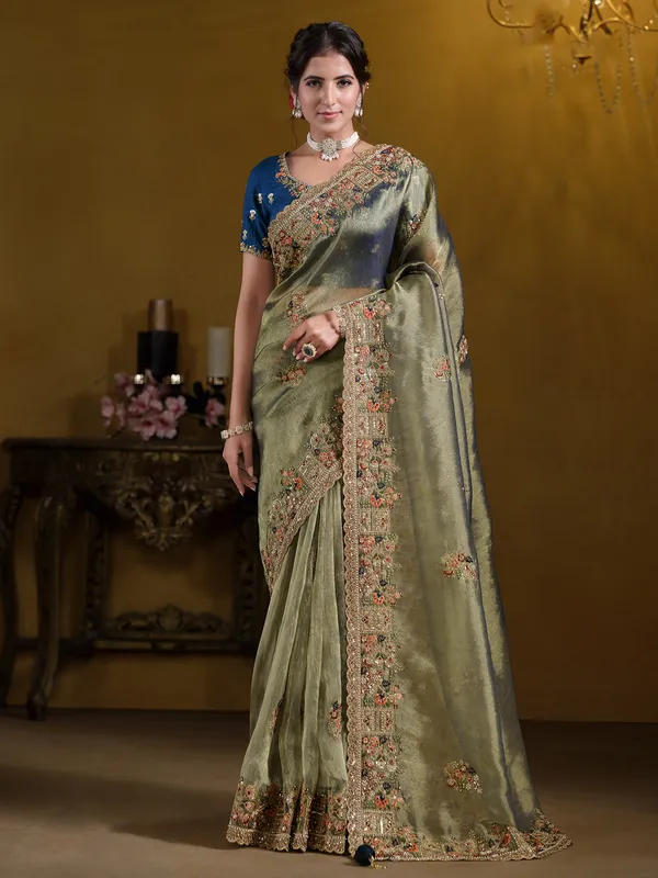 Pastel green organza saree with zardosi embroidery