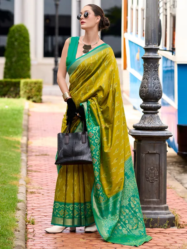 Pastel olive saree with contrast border