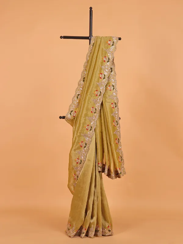 Pastel olive shimmer tissue silk saree for wedding