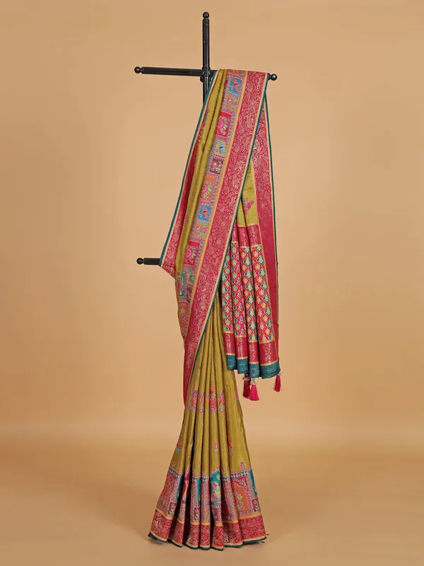 Pastel olive silk saree with zari weaving
