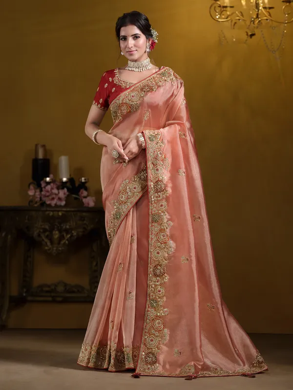 Pastel orange tissue silk saree for weddings