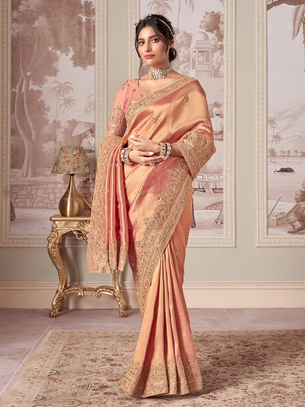 Pastel peach designer saree for celebrations