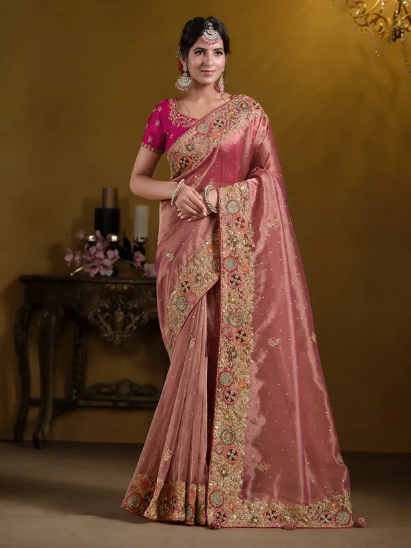 Pastel peach organza saree with zardosi work