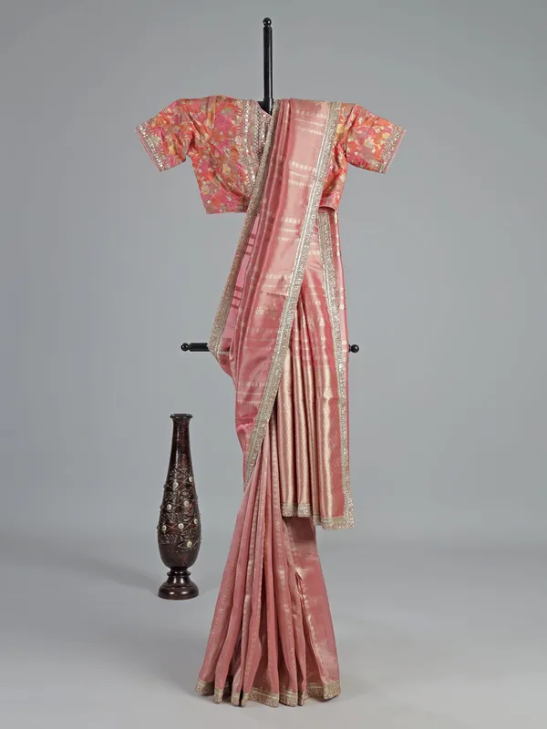 Pastel peach soft tissue saree with beaded elegance