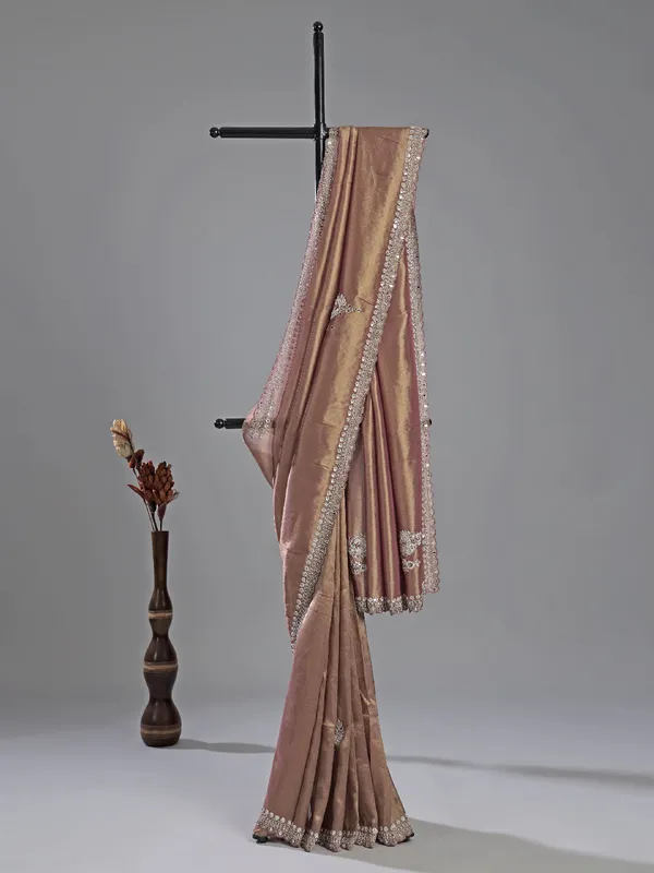 Pastel peach tissue silk saree with mirror work