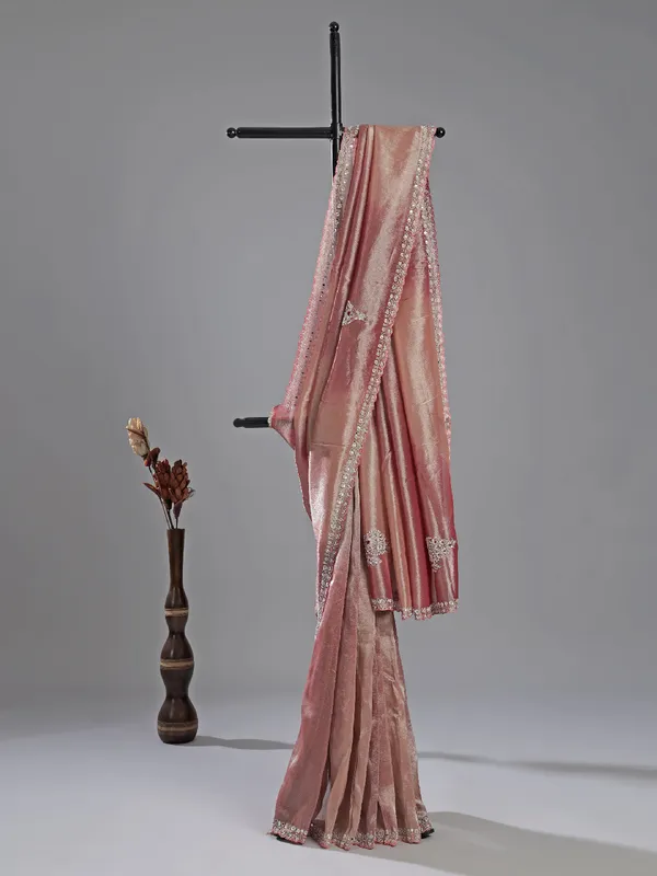 Pastel pink tissue silk saree with designer charm