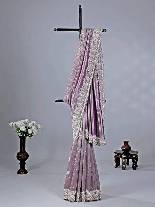 Pastel purple tissue silk saree with heavy work