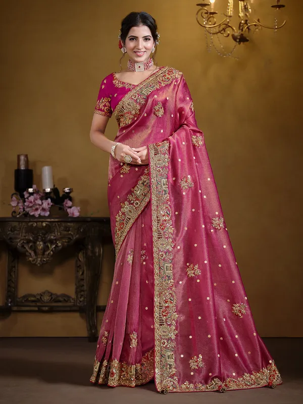 Pastel rani organza saree with zardosi work