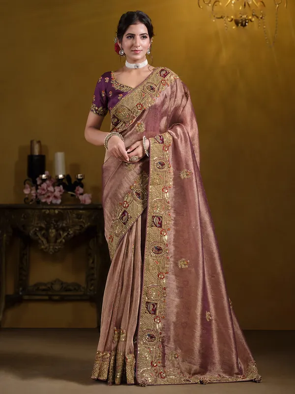 Pastel wine organza saree with heavy embellishment