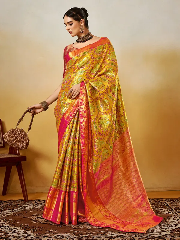 Pastel yellow festive silk saree with zari detail