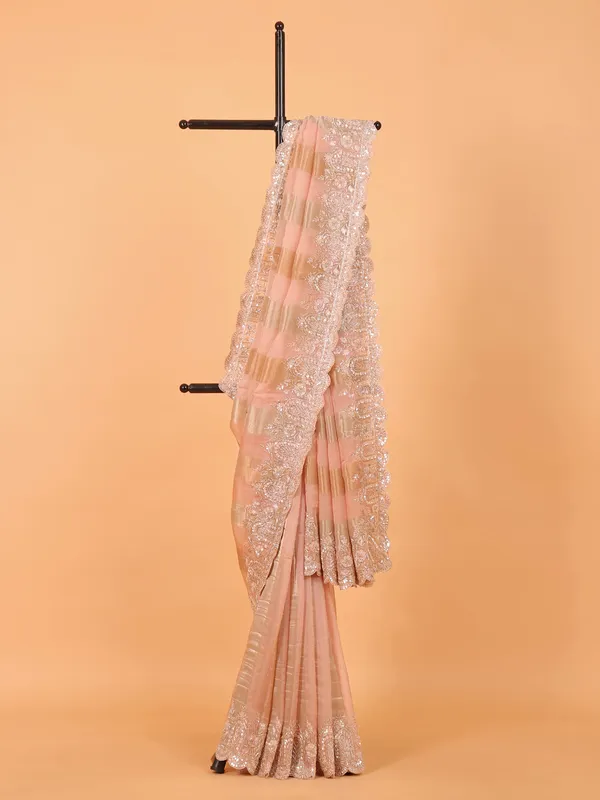Peach organza saree for wedding wear