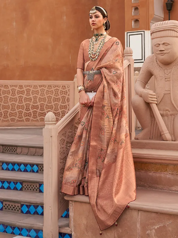 Peach printed organza saree with regal touch