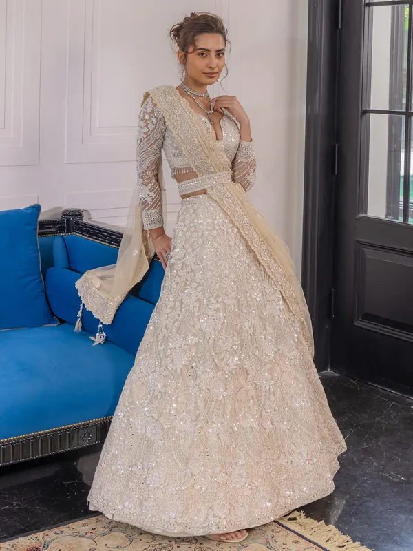 Peach reception wear lehenga choli in soft net