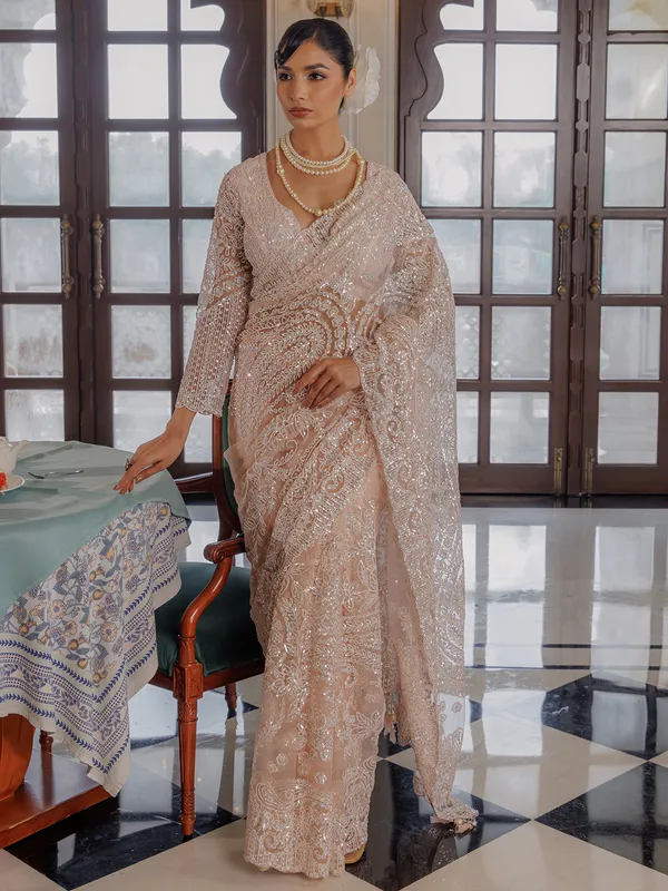 Peach sequins worked saree in soft net