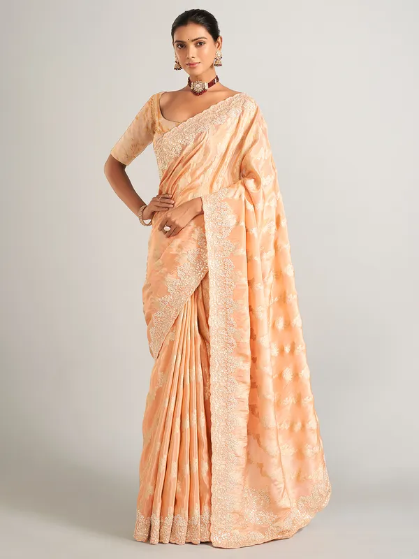 Peach silk zari worked saree with unstitched blouse
