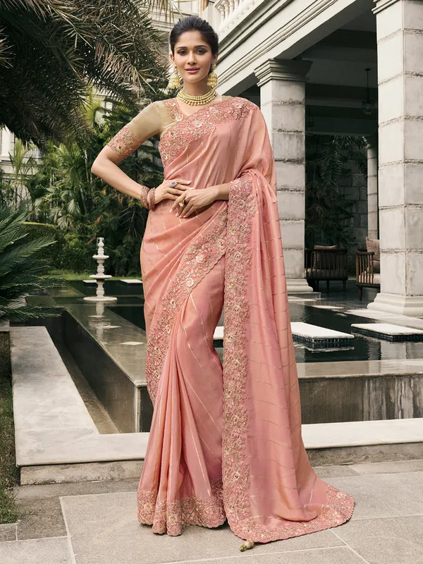 Peach tissue silk saree with zari and zardosi detailing