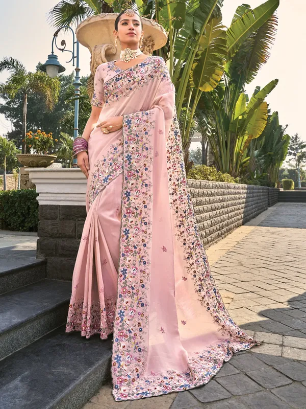 Pink banarasi saree with elegant moti accents