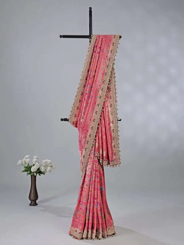 Pink kanjivaram silk saree with pearl and zardosi charm