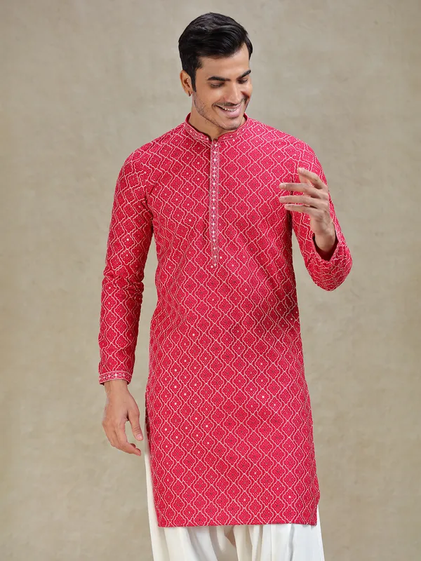 Pink kurta salwar in symmetrical embroidery pattern