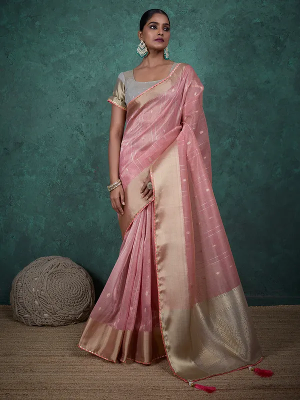 Pink linen blend saree with zari woven detailing