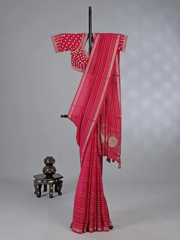 Pink organza saree with elegant zari weaving
