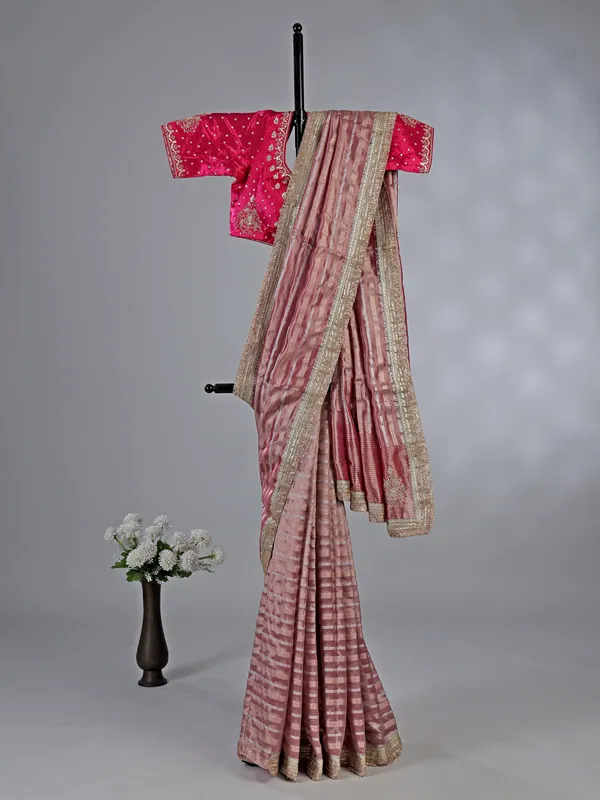 Pink organza saree with mirror and aabla work