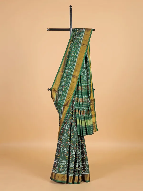 Dark green saree in bandhej silk for festive