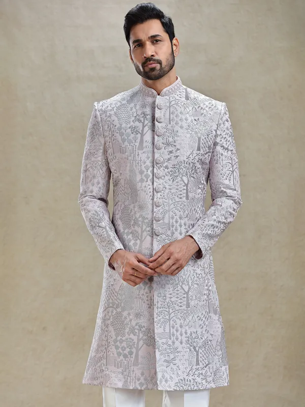 Pink silk sherwani in silver embroidery pattern