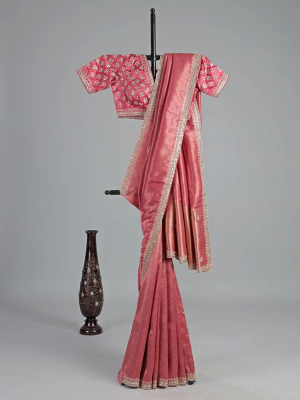 Pink soft tissue saree with cutdana V neck blouse