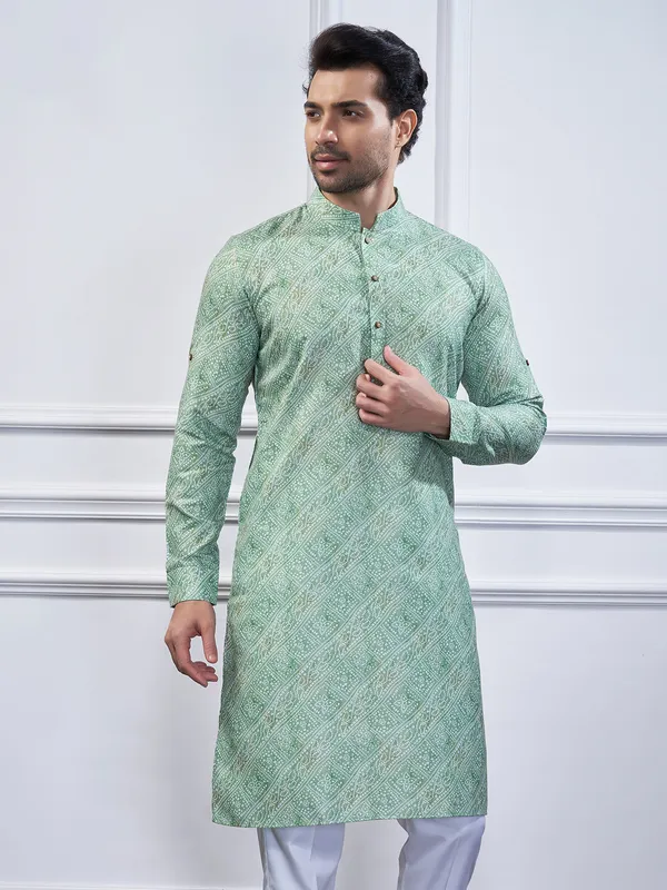 Pista green cotton printed kurta suit for festive wear