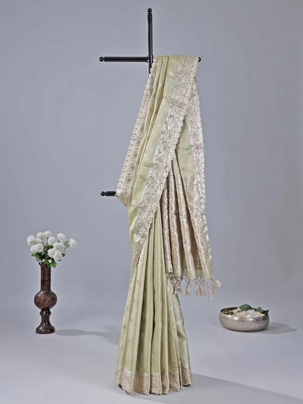Pista green heavily embellished silk saree for weddings