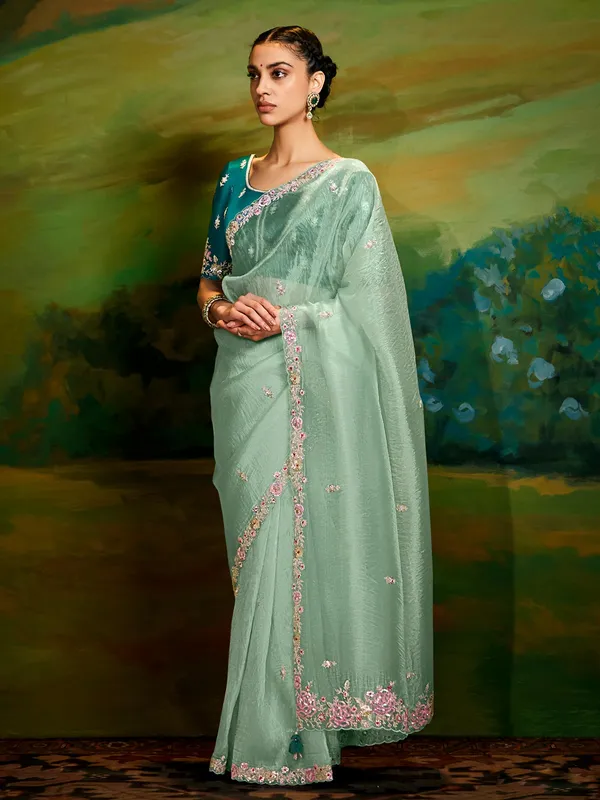 Pista green tissue silk saree for reception wear