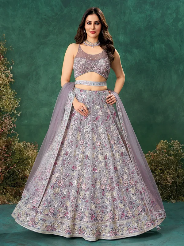 Purple net reception wear lehenga choli