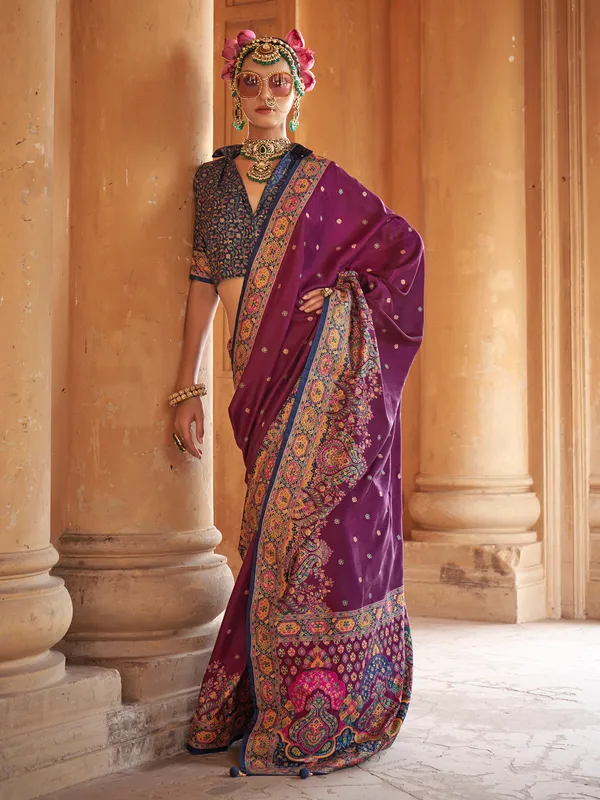 Purple silk saree featuring ethnic prints and blouse