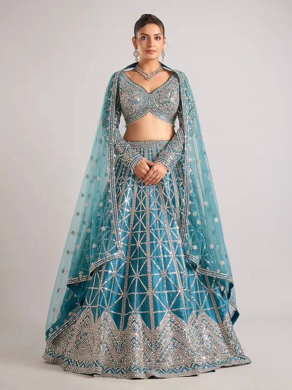 Rama green raw silk lehenga choli with mirror detailing