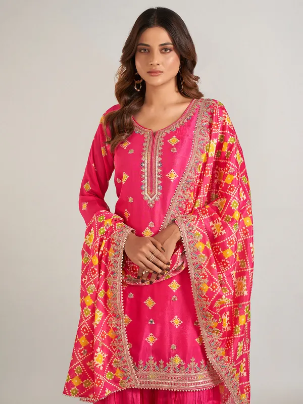 Rani color printed silk sharara suit with dupatta