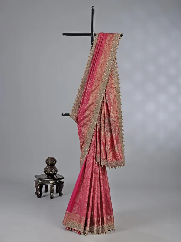 Rani pink kanjivaram silk unstitched saree with opulent detailing
