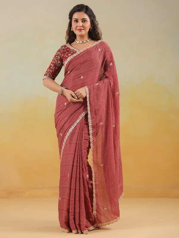 Red muslin printed saree with ready made blouse