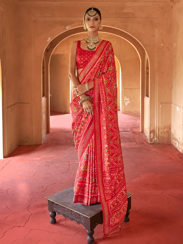 Red printed patola silk saree with unstitched blouse