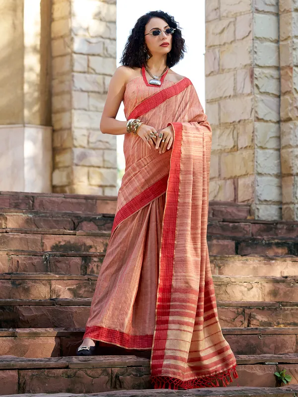 Red silk saree adorned with zari work